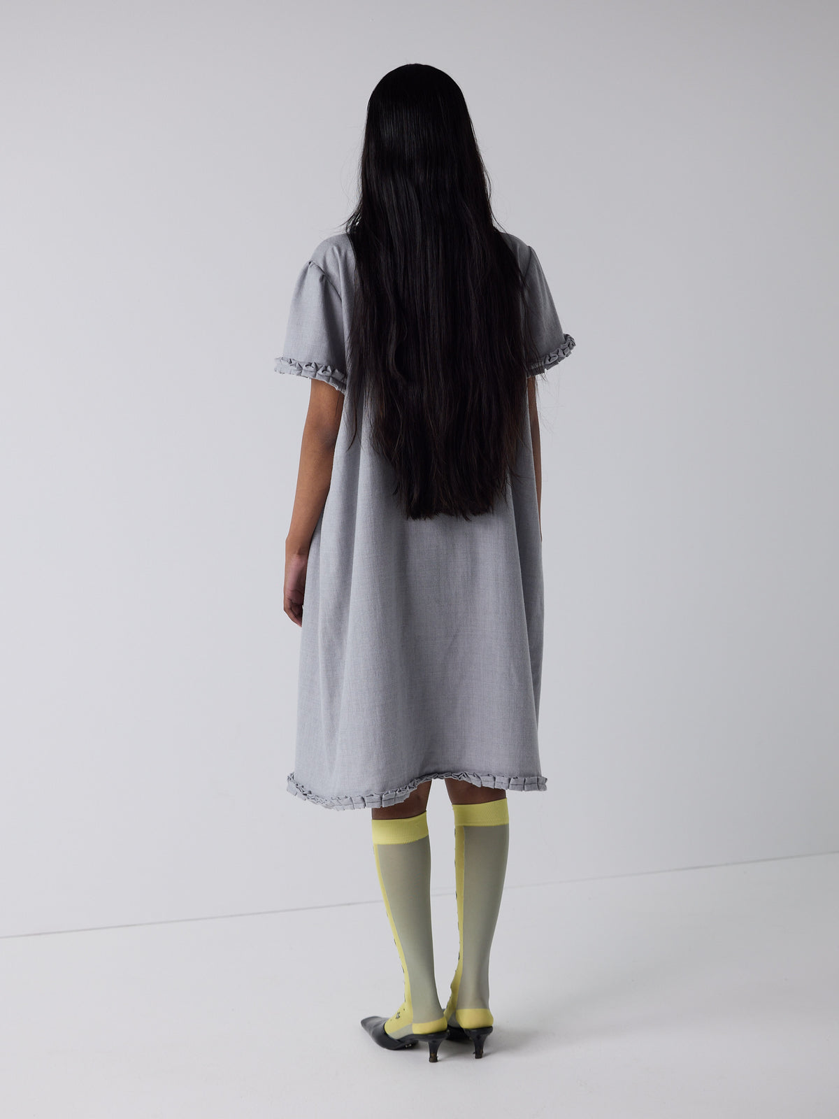 haasi wears the frill peignoir in grey