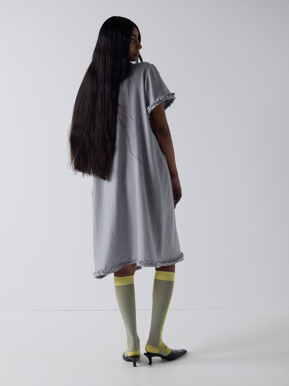 haasi wears the frill peignoir in grey