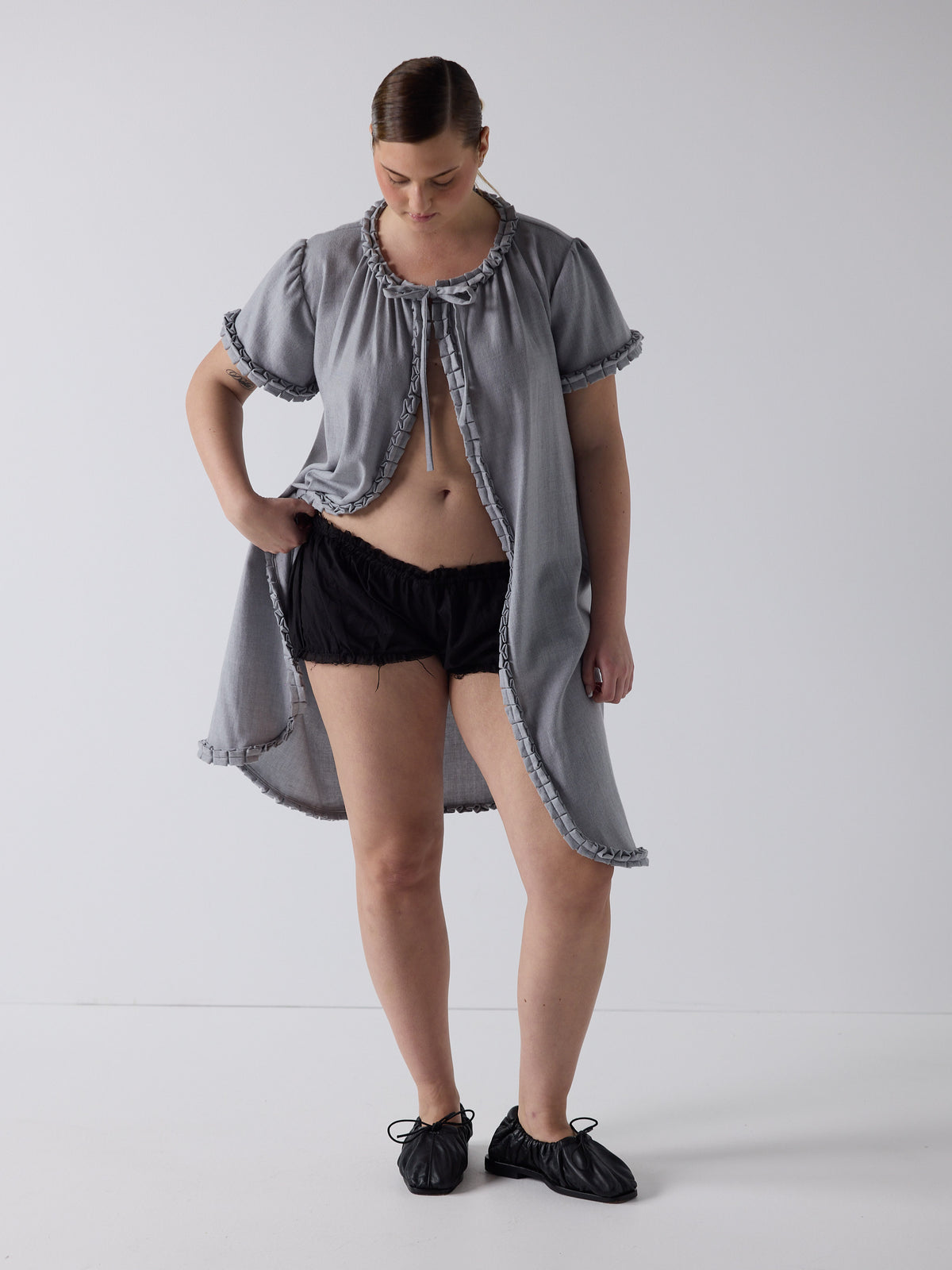 kim wears the frill peignoir in grey