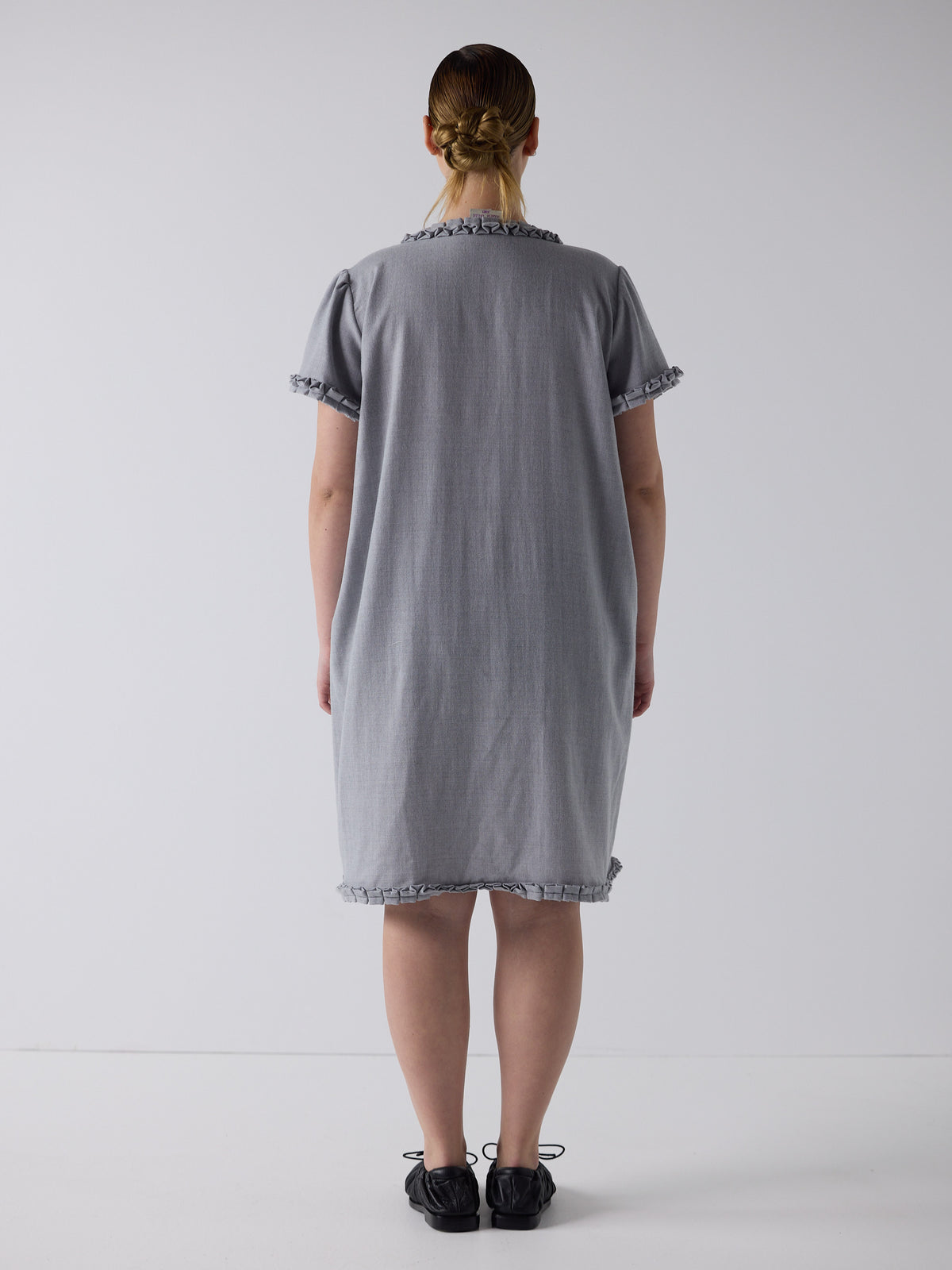 kim wears the frill peignoir in grey