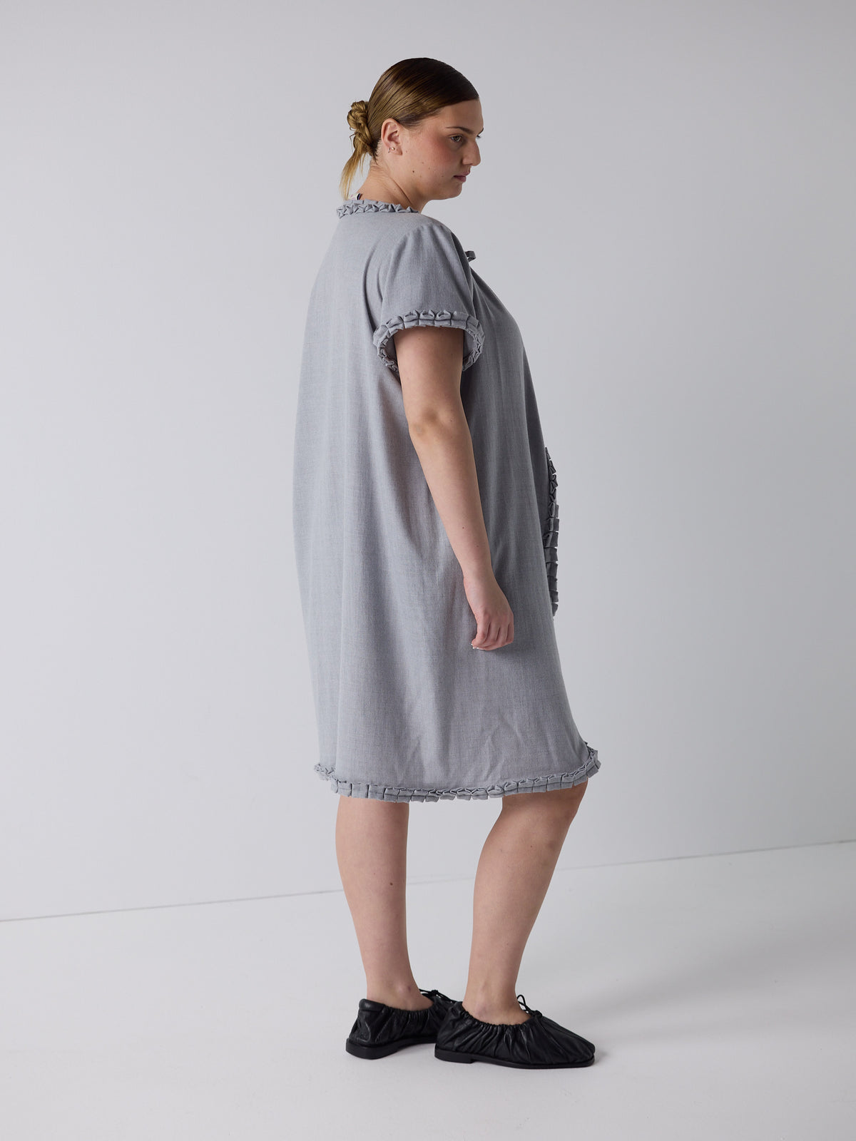 kim wears the frill peignoir in grey